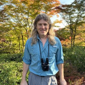 Doug Couchman outdoors among fall colours